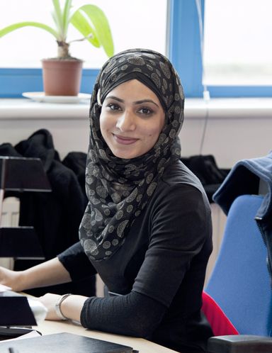 A Refugee Employability Programme Case Manager sat at her desk